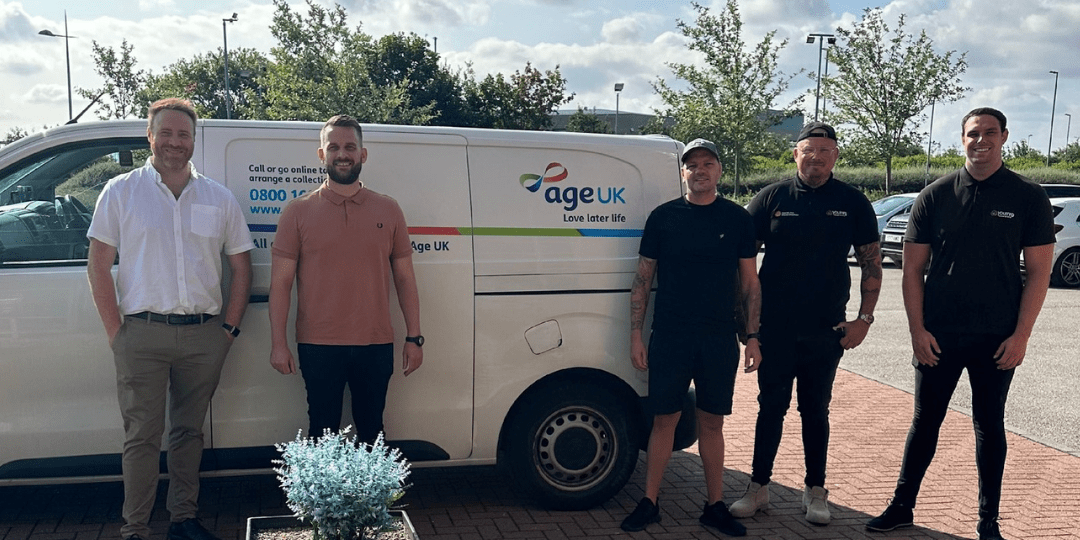 Five Men Standing in front of Age UK Van