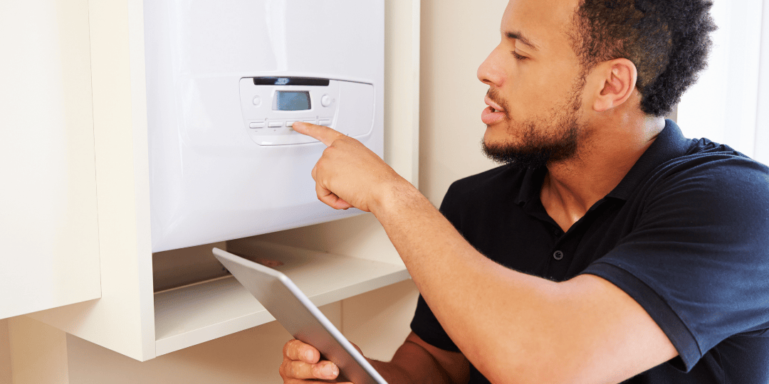 Man Adjusting Boiler Settings