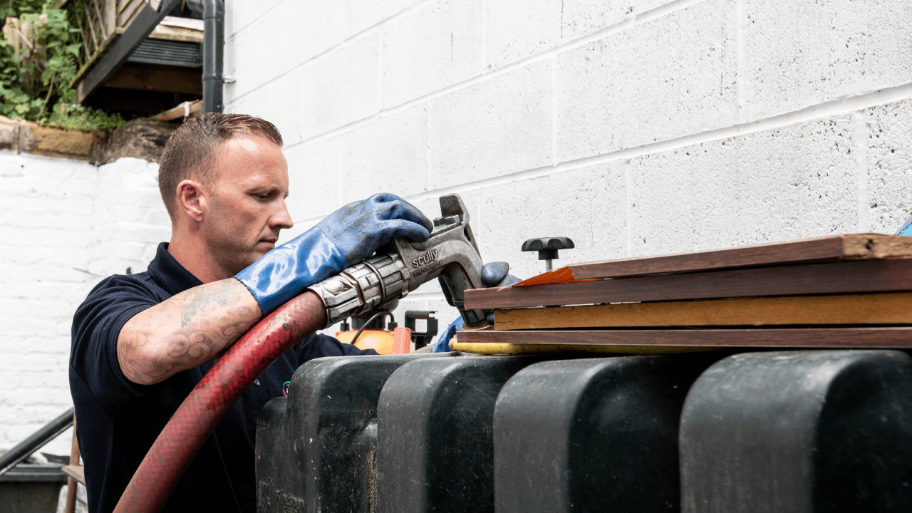 Man Refilling Oil Tanker