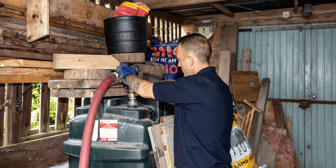 Man Filling Oil Tank