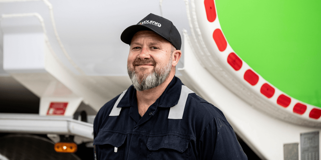 Man In Your NRG Cap Smiling Next To Tanker