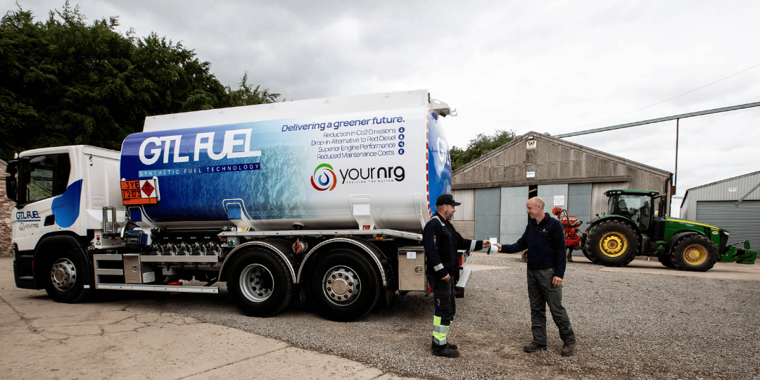 Two Men Next to Your NRG GTL Fuel Tanker and Tractor